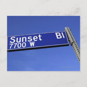 Sunset Boulevard sign against a blue sky Postcard