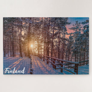 Sunset in snowy pine forest with sun ray jigsaw puzzle