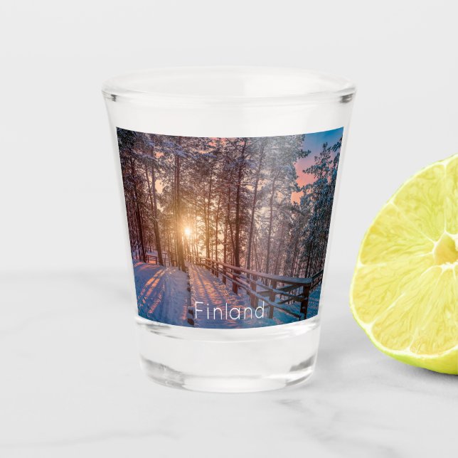 Sunset in snowy pine forest with sun ray shot glass (Front)