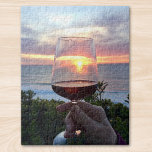 Sunset Jigsaw Puzzle<br><div class="desc">Say Cheers to the sunset and your friends! 
This jigsaw puzzle features a sunset on the French coast seen through a glass of red wine. Santé</div>