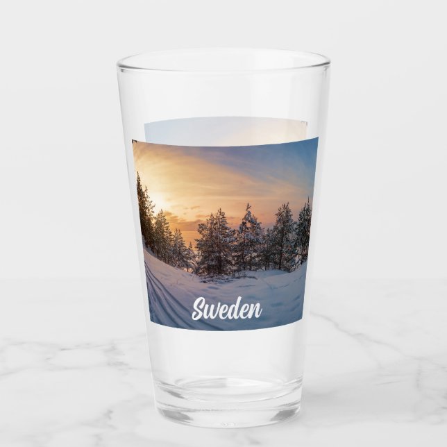 Sunset over frozen snowy forest near sea glass (Front)