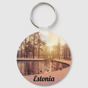 Sunset over park with small frosty lake keychain