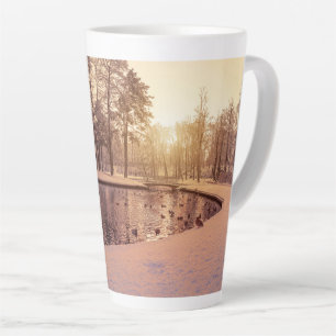 Sunset over park with small frosty lake latte mug