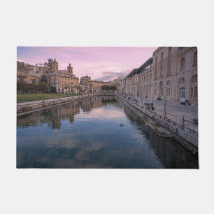 Sunset over small canal in Cospicua, Malta Doormat