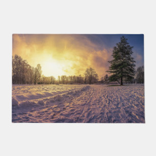 Sunset over snowy winter park doormat
