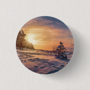 Sunset over snowy winter sea coast 1 inch round button