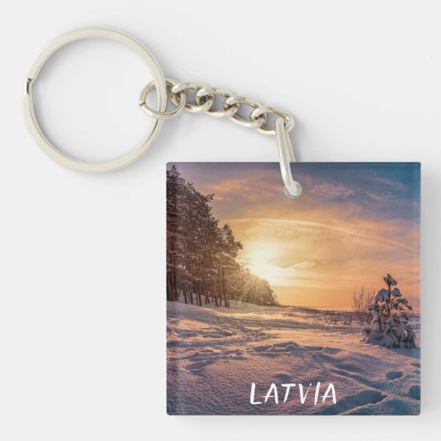 Sunset over snowy winter sea coast keychain (Front)