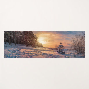 Sunset over snowy winter sea coast yoga mat