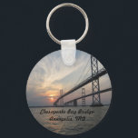 Sunset over the Chesapeake Bay Bridge Keychain<br><div class="desc">As the sun sets in this beautiful original photograph, the water reflects the orange, pink and yellow sunset. The swirling clouds in the background add a unique look. This would make a great gift or a great reminder of Annapolis. It could be a souvenir from a trip to Maryland also....</div>