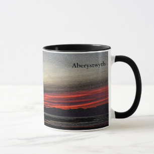 Sunset over the sea in Aberystwyth mug
