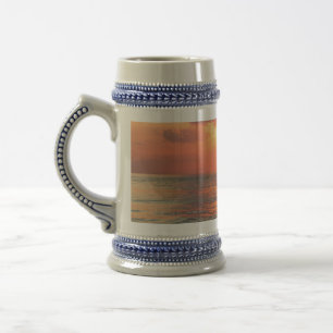 sunset over water beer stein