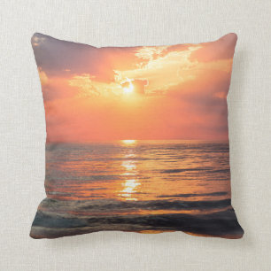 sunset over water throw pillow