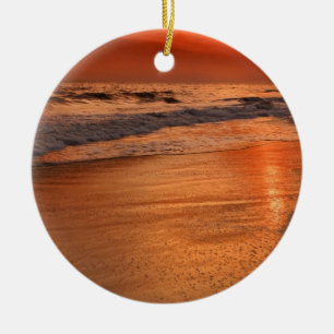 Sunset reflections off clouds and ocean shore ceramic ornament