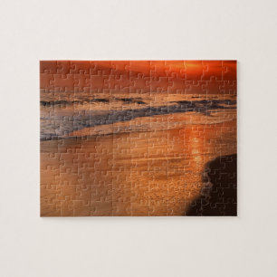 Sunset reflections off clouds and ocean shore jigsaw puzzle