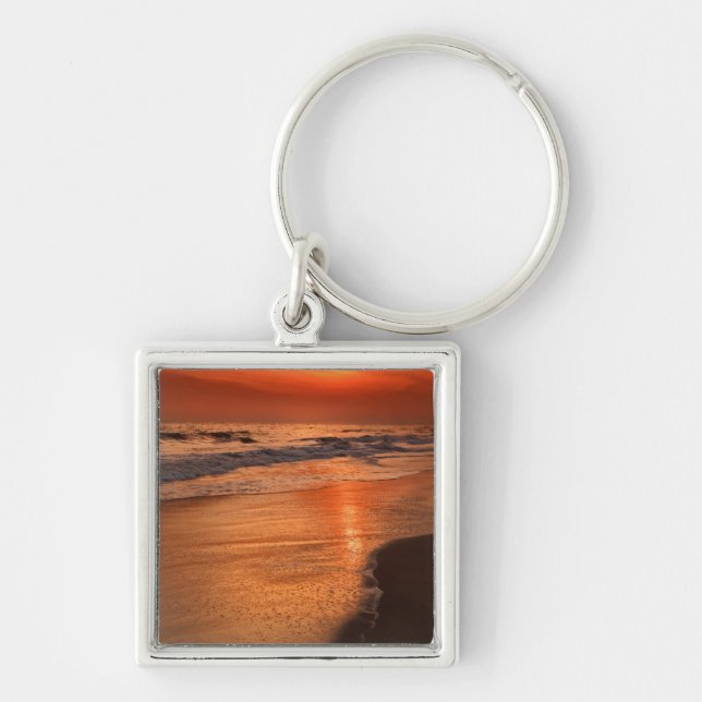 Sunset reflections off clouds and ocean shore keychain (Front)