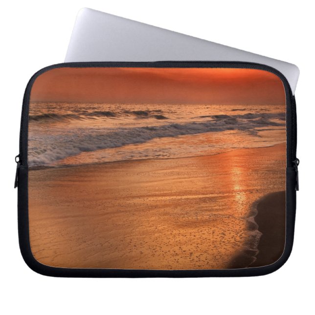 Sunset reflections off clouds and ocean shore laptop sleeve (Front)