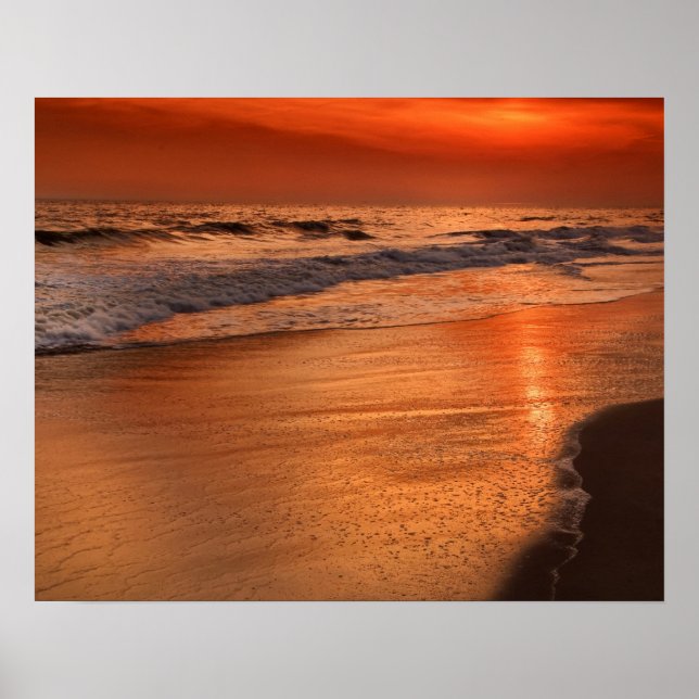 Sunset reflections off clouds and ocean shore poster (Front)