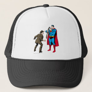 Superman bends a gun trucker hat