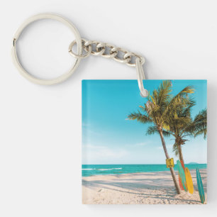 Surf boards on beach throw pillow keychain