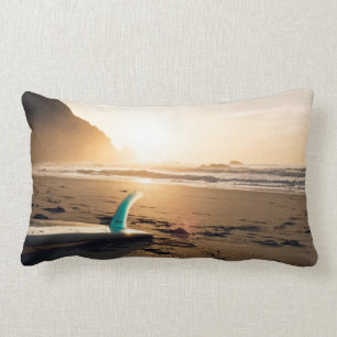 Surf Themed, Surfboard Lays On The Sandy Beach As Lumbar Pillow