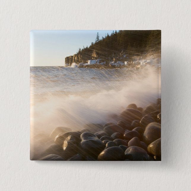 Surf washes over the cobblestones in Monument 2 Inch Square Button (Front)