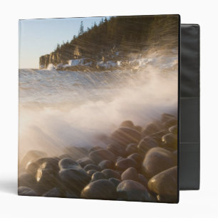 Surf washes over the cobblestones in Monument Binder