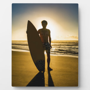 Surfer silhouette during sunrise plaque