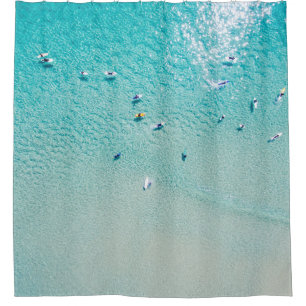 Surfers aerial view, clear ocean.