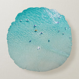 Surfers aerial view, clear ocean. round pillow