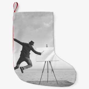 surreal black and white art painter drawing on a c small christmas stocking
