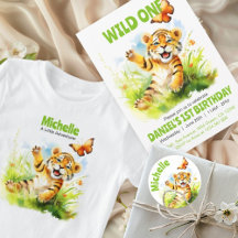 A Cute Baby Tiger Playing with a Butterfly