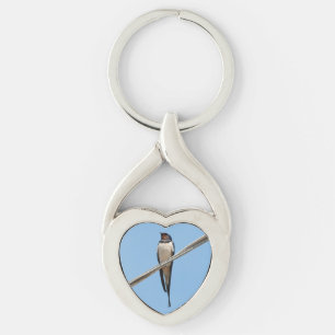 Swallow sitting on wire keychain
