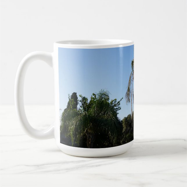 Swaying Palm Tree Under a Clear Sky Coffee Mug (Left)