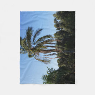 Swaying Palm Tree Under a Clear Sky Fleece Blanket