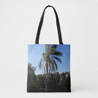 Swaying Palm Tree Under a Clear Sky Tote Bag
