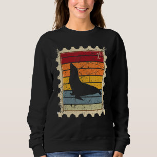 Sweatshirt Timbre avec un phoque de port au coucher du soleil