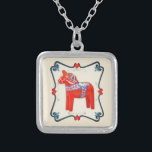 Swedish Dala Horse Folk Art Framed Silver Plated Necklace<br><div class="desc">Traditional folk art carved wooden horse from the Dalarna region of the Scandinavian country of Sweden,  in Norwegian rosemaling inspired frame scroll of hearts and flowers.  Dala hast horses are often seen during the Christmas holidays in Sweden,  Norway and Denmark.  From Scandinavian Gifts.</div>
