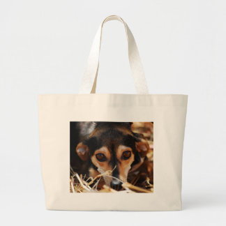 Sweet dog laying in hay large tote bag