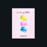 "Sweet Essence of Life Personalized French Macaron Canvas Print<br><div class="desc">Celebrate the sweetness of life with our "Sweet Essence of Life" Personalized Canvas Print, featuring a delightful watercolor painting of French macarons (macaroons). This elegant artwork showcases an array of macarons in soft yellow, pink, and blue hues, set against a charming pink background, encapsulating the beauty and simplicity of life....</div>