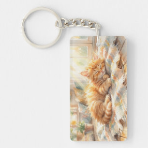 Sweet little kitten sunbathing keychain