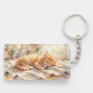 Sweet little kitten sunbathing keychain