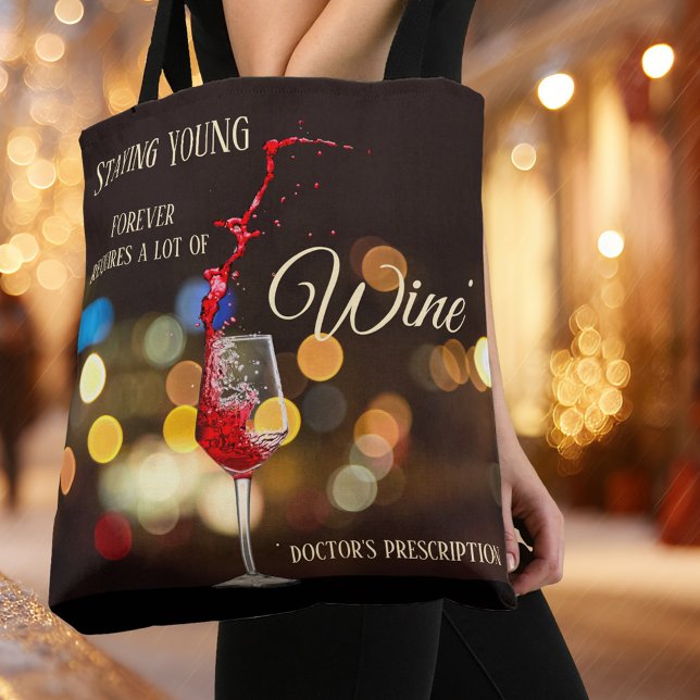Swirling Wine Light Sparkles Tote Bag (Tote bag with a wine theme featuring a glass of swirling wine on a sparkling light night scene )