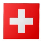 Switzerland Flag Tile<br><div class="desc">The Swiss flag is a square with a cross in the centre. The used colours in the flag are red, white. The proportion of the Swiss flag is 1:1. The Flag of Switzerland was adopted in 1889. The first use of the current flag design was in 1470. The last change...</div>