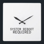 System Reboot Required Minimalist Typewriter  Square Wall Clock<br><div class="desc">Time for a change. This modern wall clock features sharp typewriter numerals and a central message reminding you that every hour is an opportunity to reset.</div>