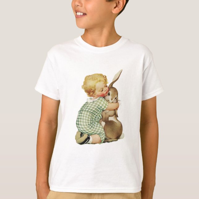 T-SHIRT BÉBÉ ÉTREIGNANT LE LAPIN DE PÂQUES (Devant)