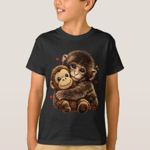 T-shirt Bébé singe mignon serrant dans ses bras un ours en