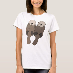 T-shirt Loutre tenant la pièce en t mignonne de graphique