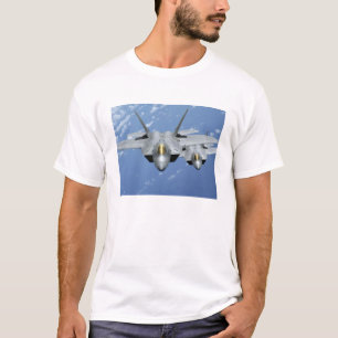 T-shirt Mouche de deux F-22 Raptors au-dessus de l'océan