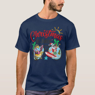 T-shirt Noël En Juillet Plage Flamant rose Père Noël Surf 