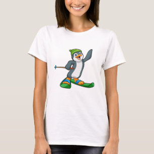 T-shirt Pingouin comme skieur avec ski et Casquette